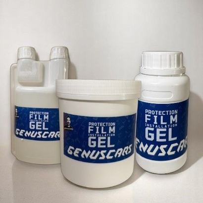 Three bottles of Genuscars protection Film Gel displayed on a light surface, showcasing the product's blue and white packaging